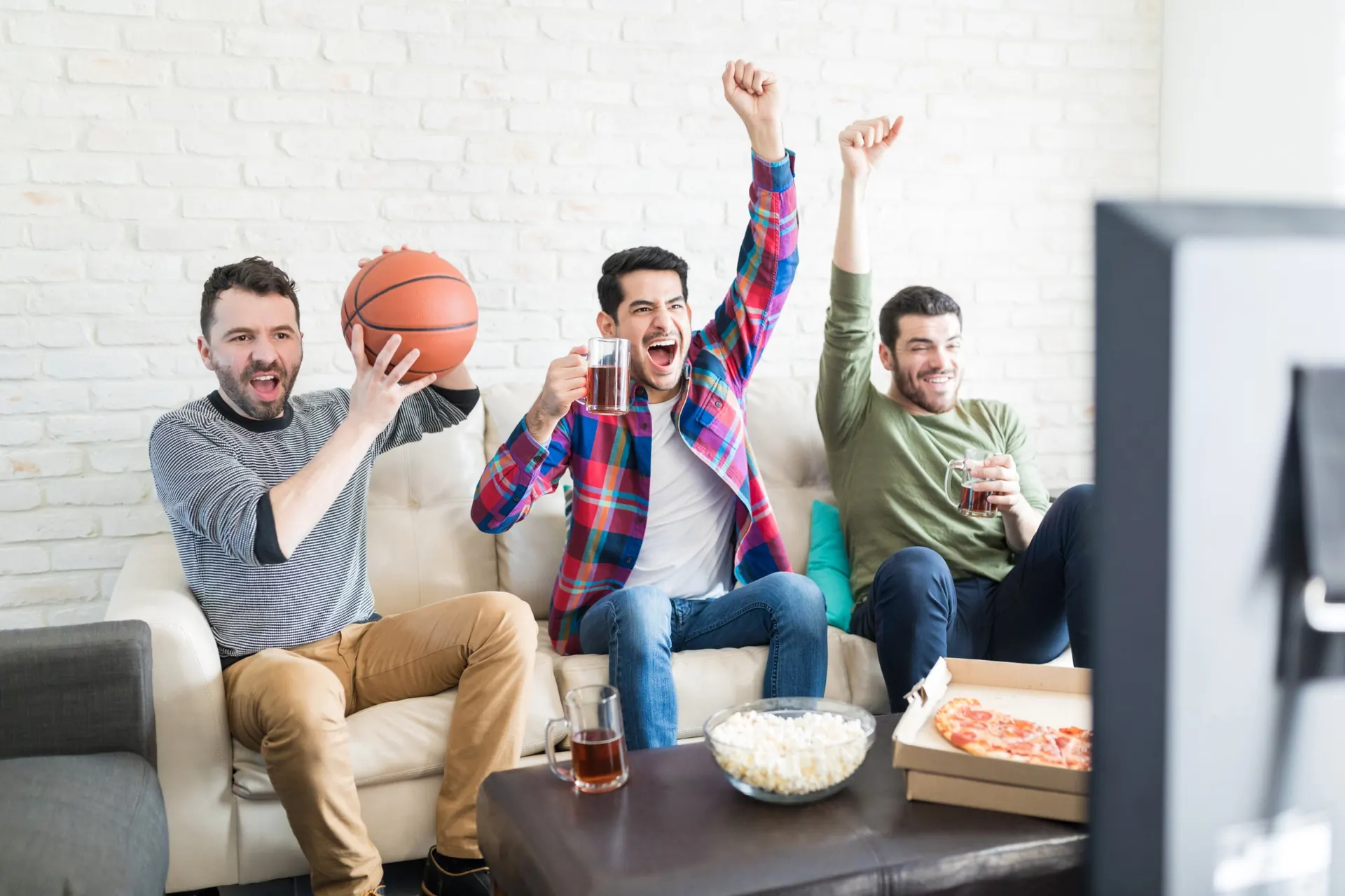 Fans watching a game at home