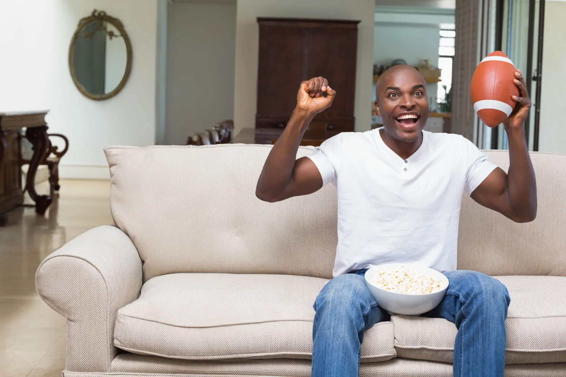 Fans watching a game at home