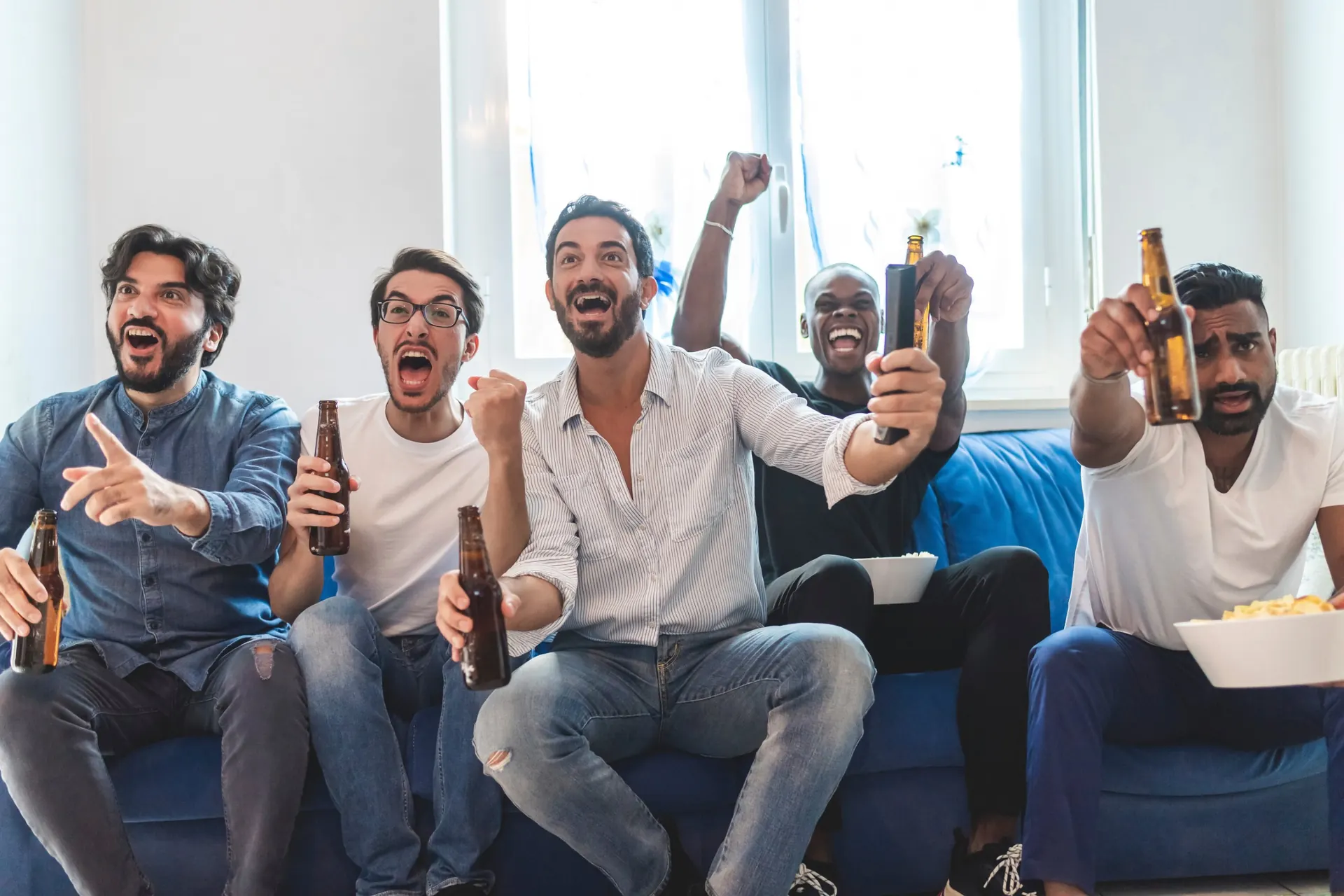 Fans watching a game at home