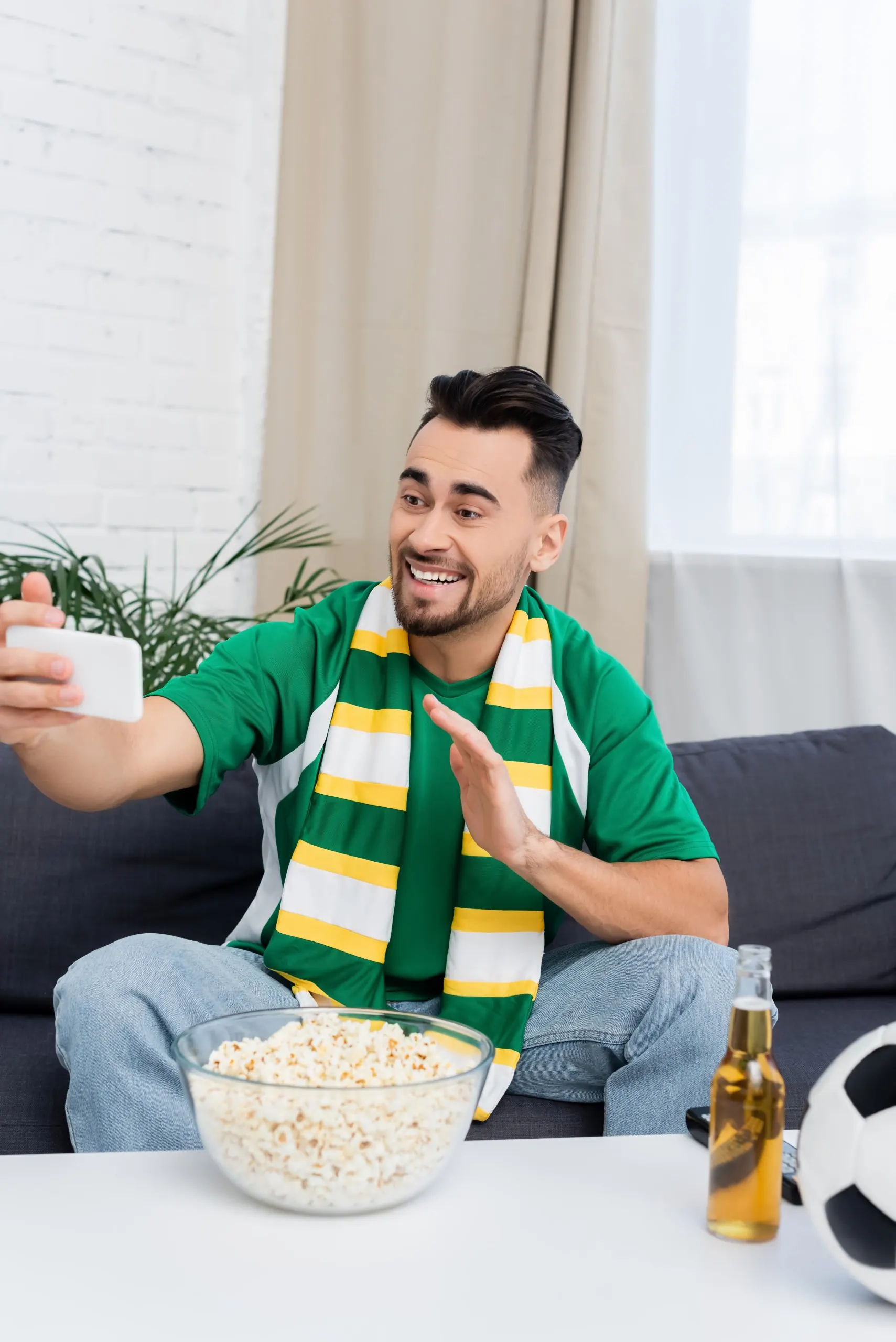 Fans watching a game at home